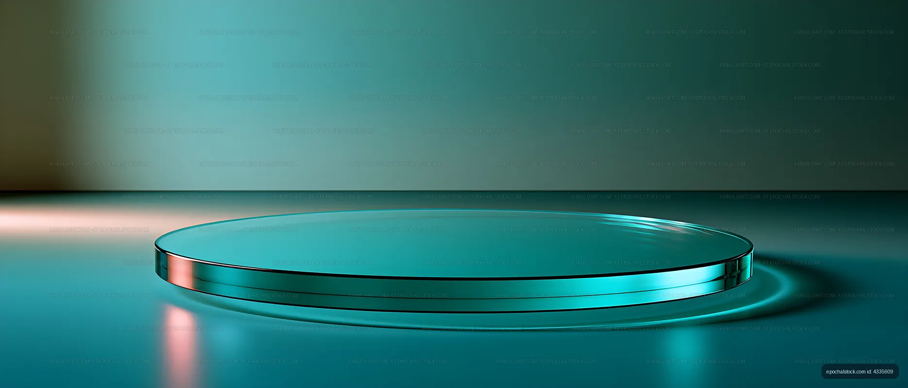 Reflective teal glass disc with colored studio lighting