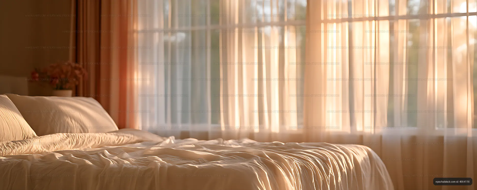 Cozy bedroom with sunlight through sheer curtains