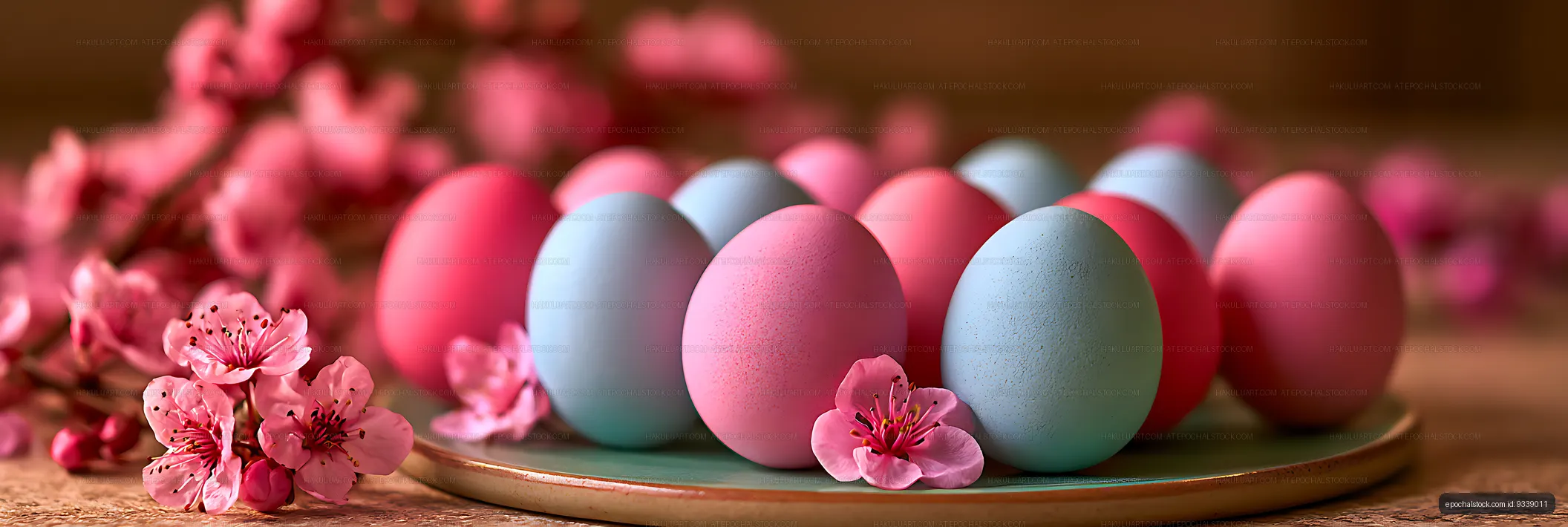 Pink and blue eggs arranged with flowering branches