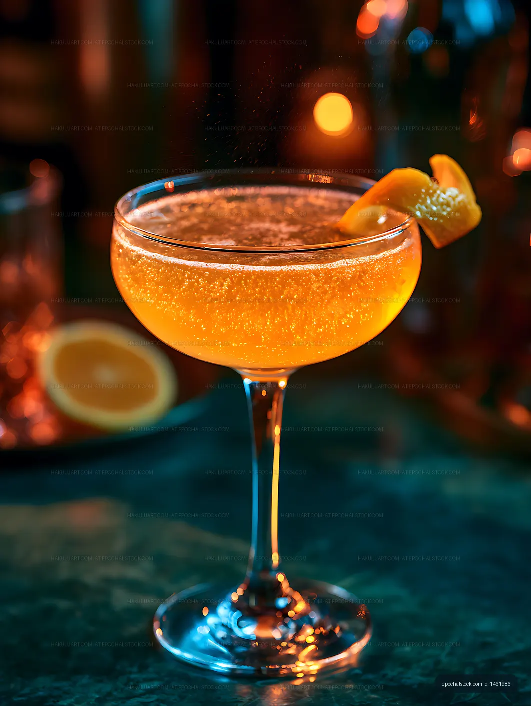 Sparkling orange drink with citrus garnish and bokeh lights