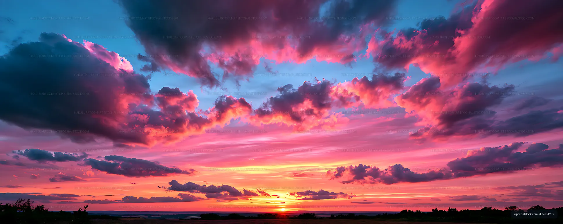Dramatic panoramic sunset with vivid pink clouds