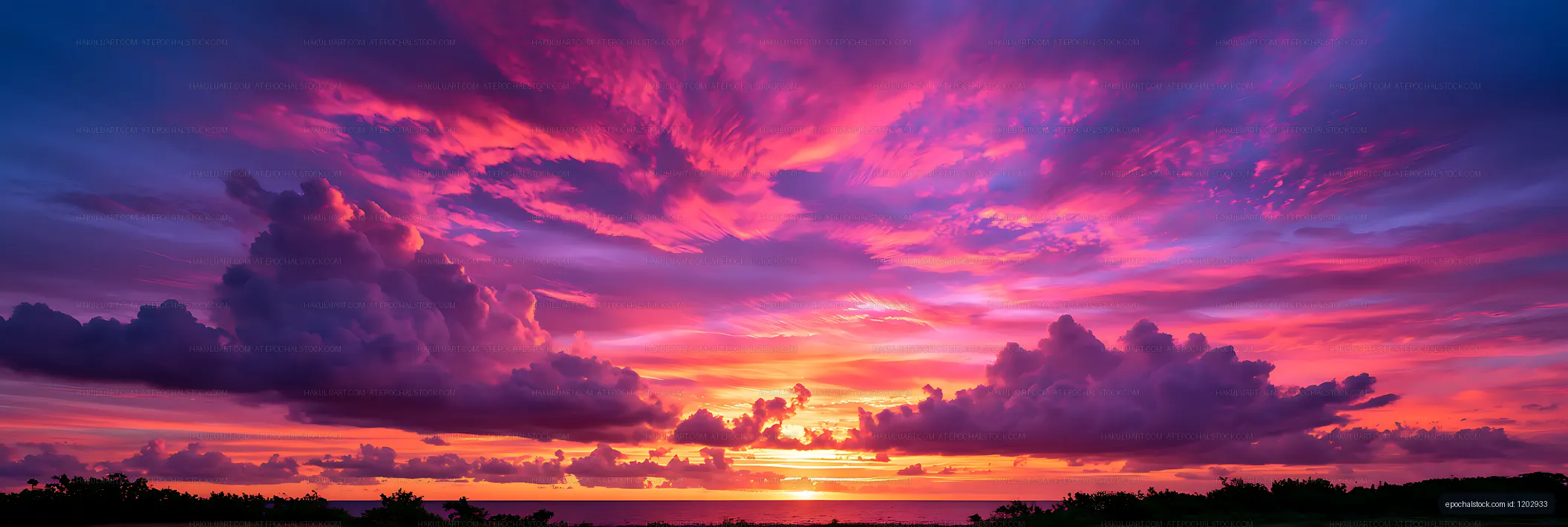 Pink and purple sunset clouds above the ocean