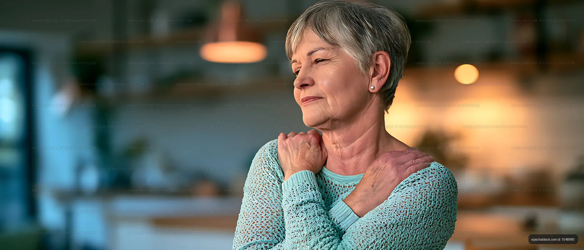Woman stretching shoulders in a warm indoor setting