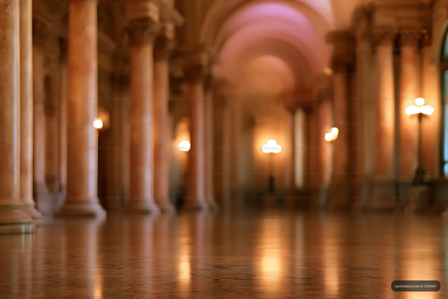 Soft focus interior with columns, arches, and warm lights