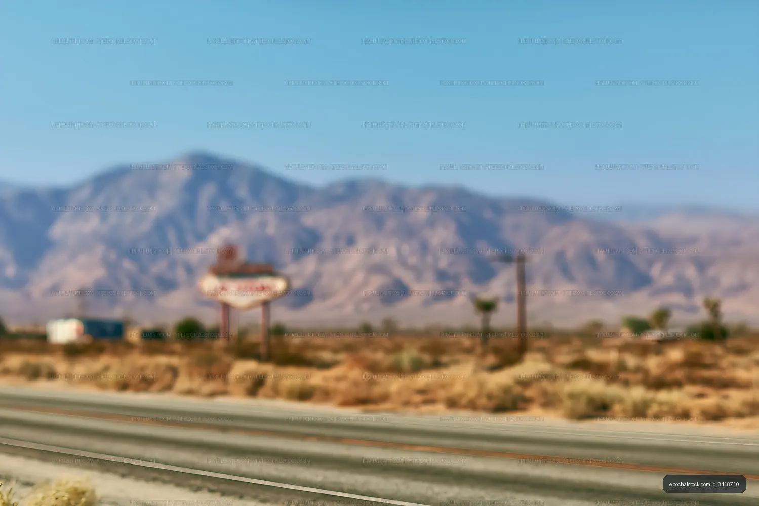 Blurred highway crossing an arid mountain landscape
