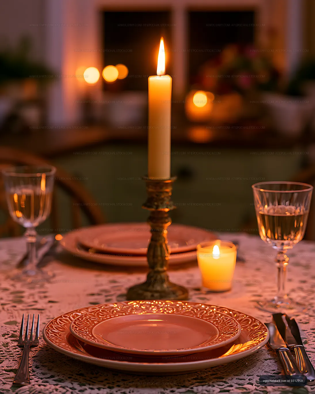 Elegant dinner setting illuminated by candles