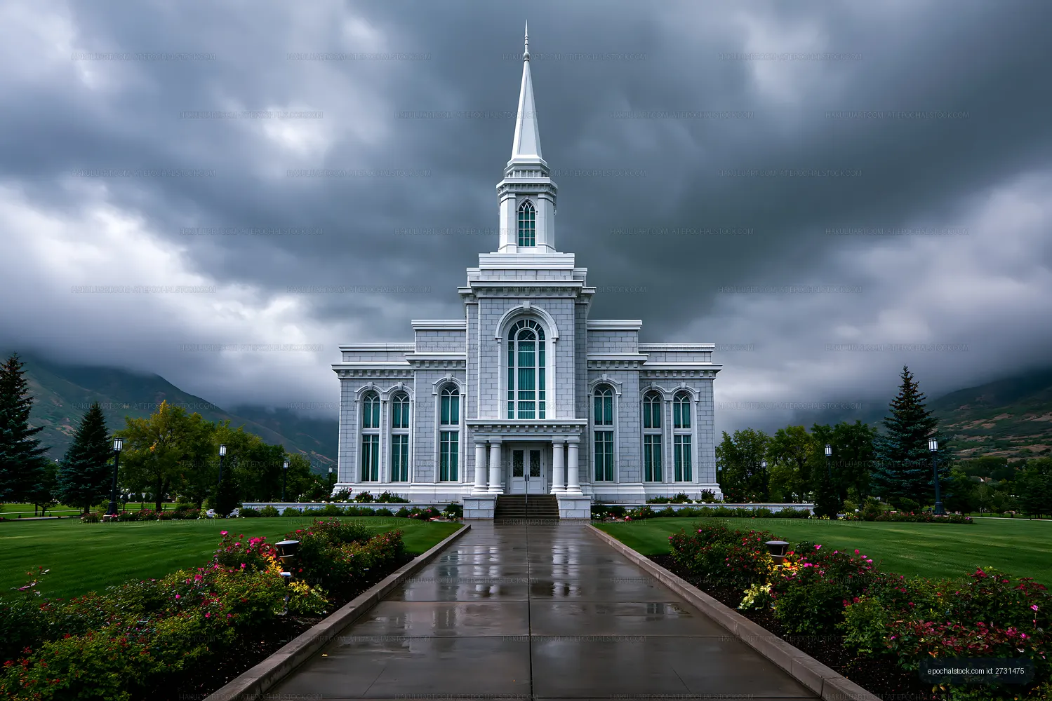 White steepled church in a mountain landscape after rain