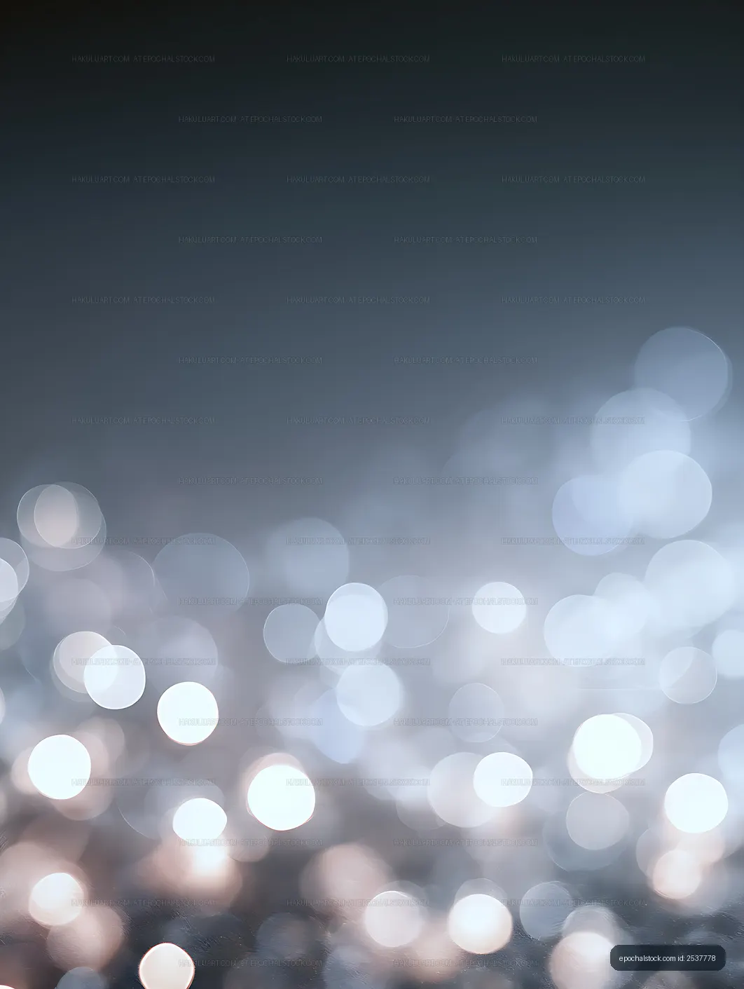Blue bokeh light background with bright circular reflections