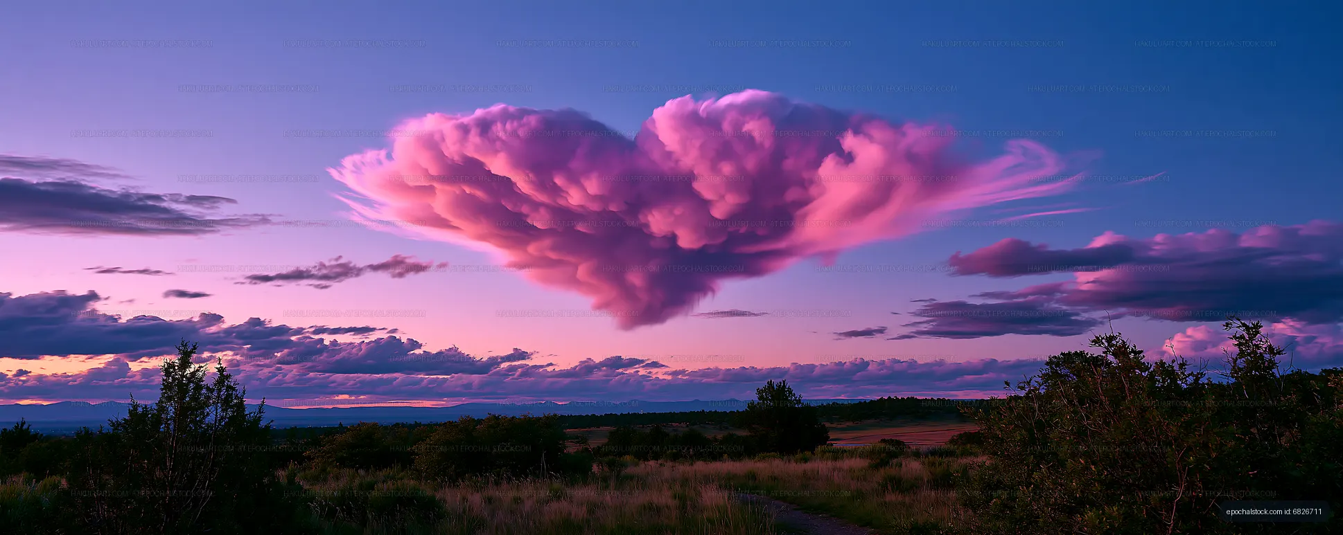 Pink and purple cloudscape over a rural sunset view