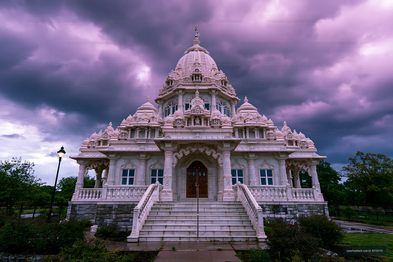 Detailed Hindu temple with domes and dramatic cloudy sky