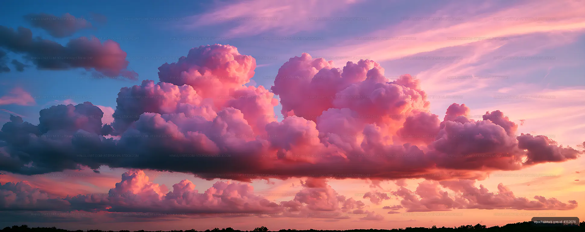 Pink and purple clouds glowing at sunset