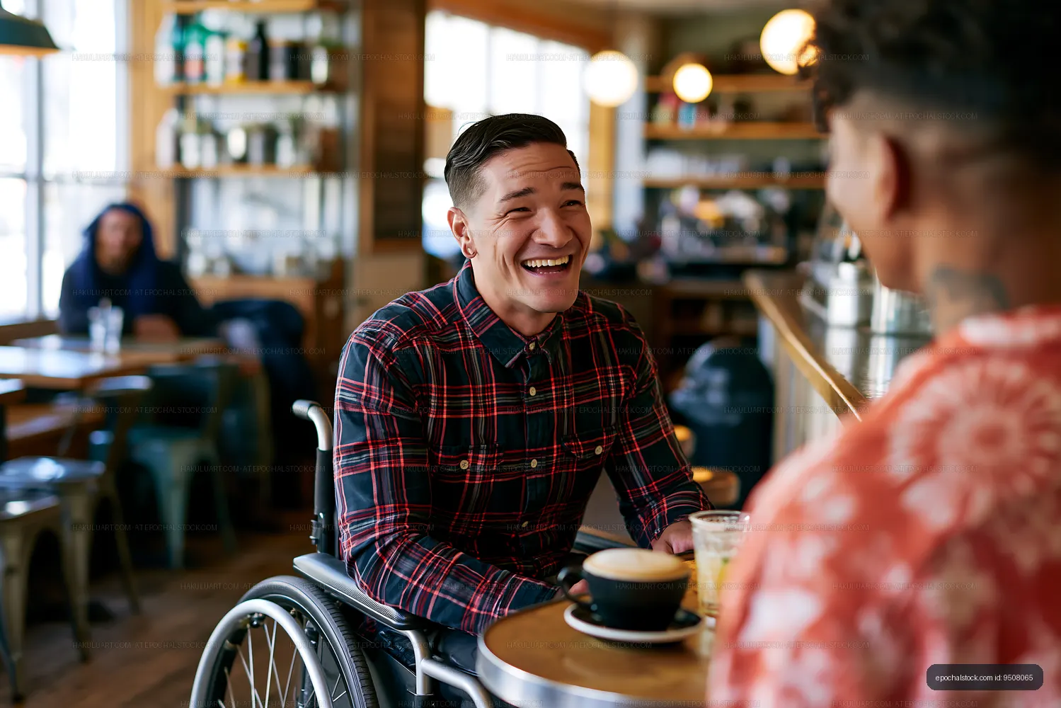 Joyful cafe conversation with man using wheelchair