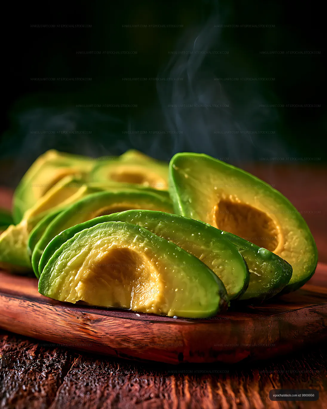 Fresh avocado pieces arranged on a wooden board