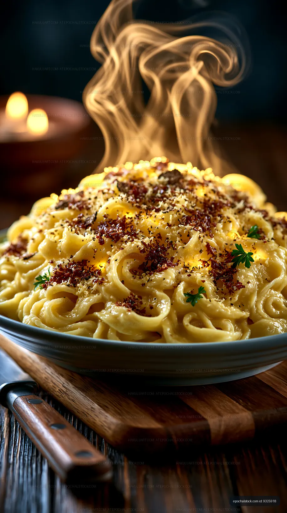 Steaming creamy pasta with herbs on a wooden table