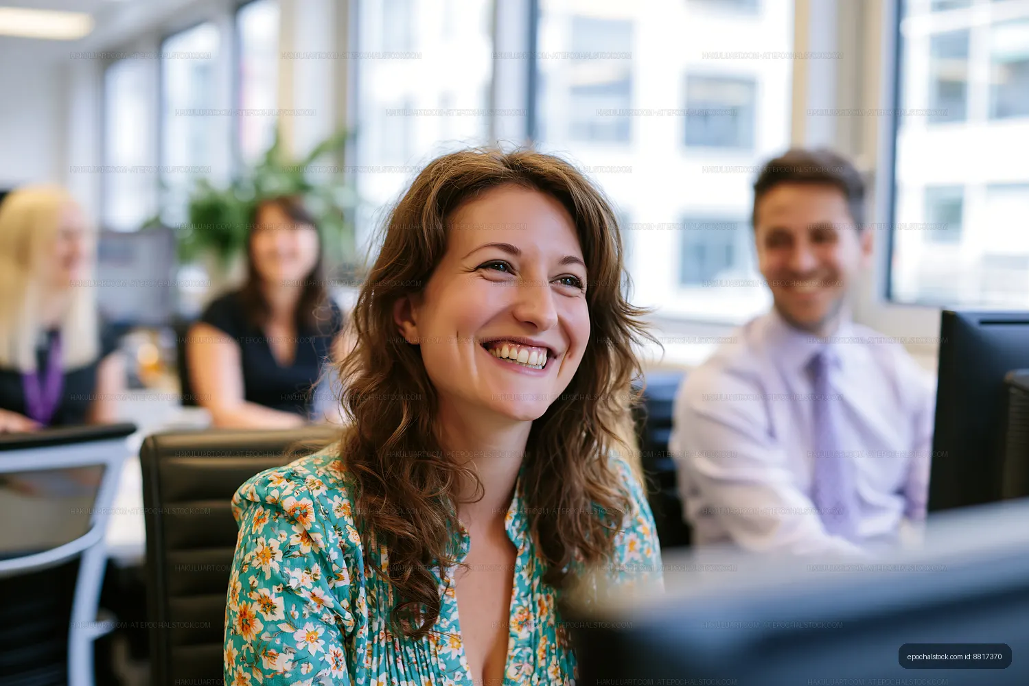Joyful woman smiling in a contemporary workplace