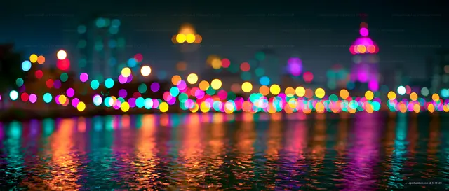 City lights reflected on water at night