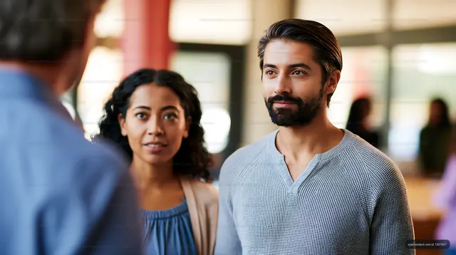 Couple engaging in conversation at community gathering indoors