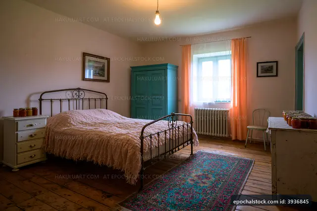 Cozy bedroom with wooden floor and vintage furnishings