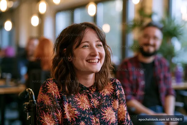 Woman smiling in cafe during social gathering with friends