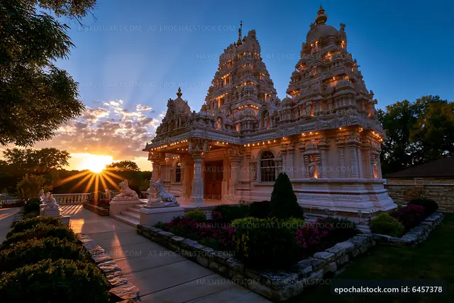 Temple with decorative lights at sunset