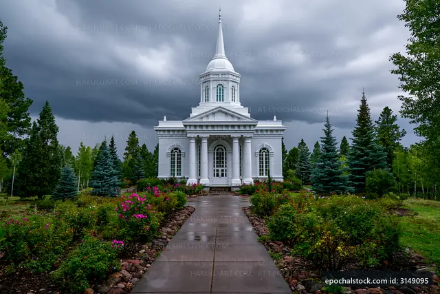 White church building under dark clouds with trees and flowers