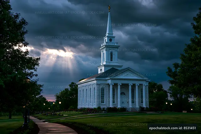 White church under dark clouds with light rays