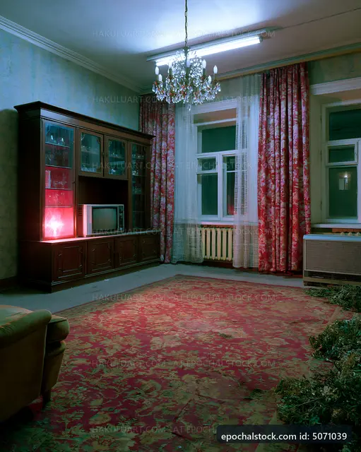 Old living room with vintage furniture and decorative curtains
