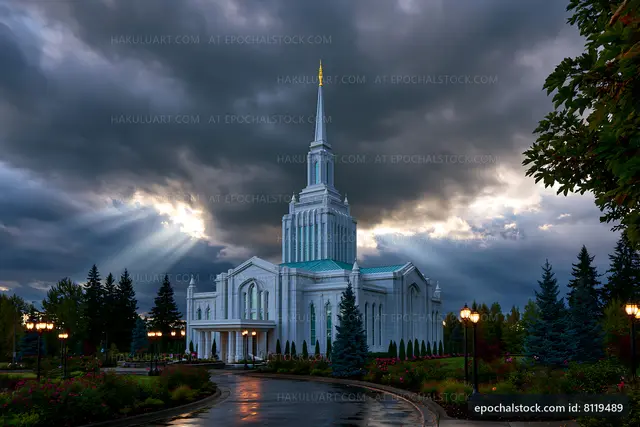 Modern church building under a cloudy sky with sunlight rays
