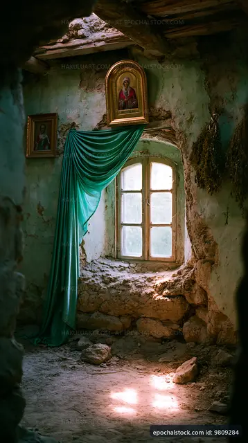 Old room with window and religious icons in abandoned building