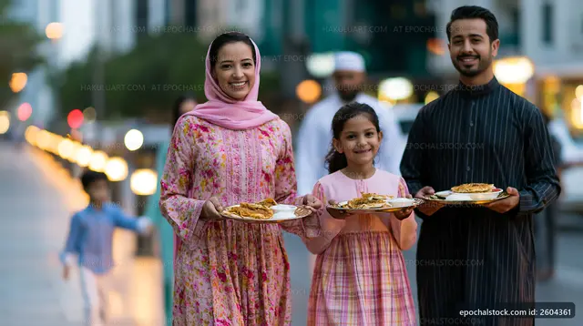 Family sharing traditional food on a city street at evening time