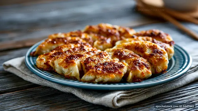 Delicious grilled dumplings served on a blue plate