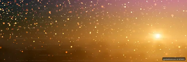 Golden light with particles in a soft gradient background