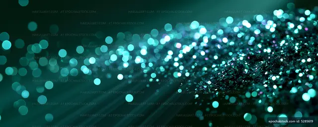 Glittering turquoise bokeh on a dark background
