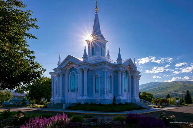 Beautiful church with a spire and sunlight in clear sky