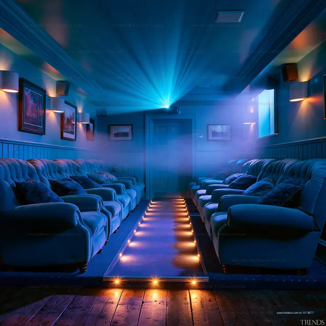 Cozy home theater with blue lighting and comfortable seating