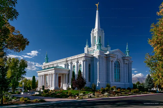 Stunning church building under a blue sky with trees