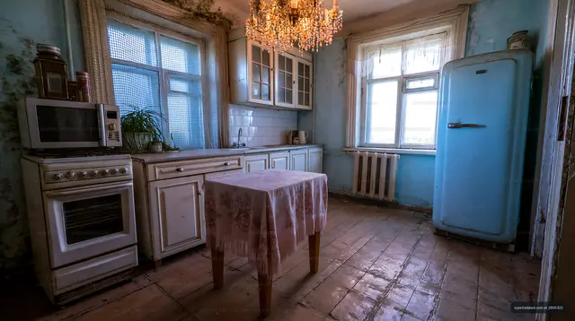 Old kitchen with retro appliances and a small table