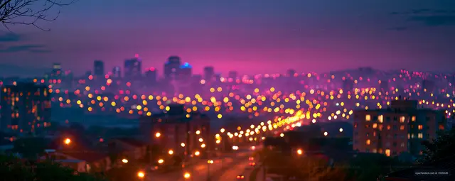 City skyline at dusk with blurred lights and buildings