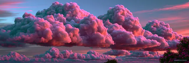 Pink clouds at sunset over a landscape