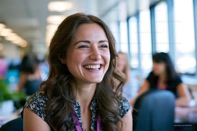 Smiling woman in casual setting at a social gathering