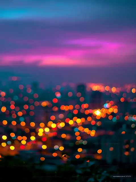 City skyline at night with blurred colorful lights