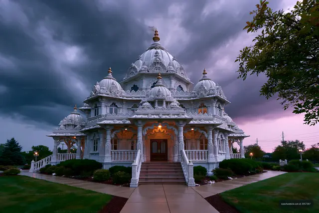 Hindu temple under cloudy sky at twilight