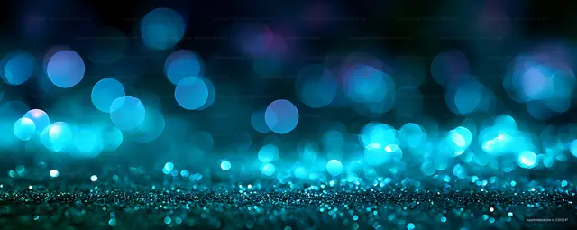 Blue bokeh lights and glittering abstract texture