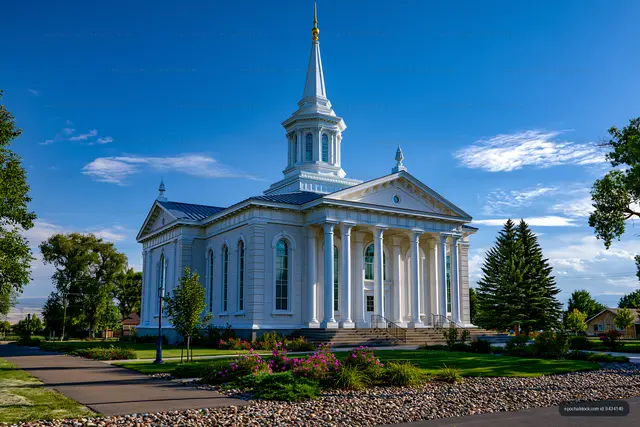 Neoclassical white church under a blue sky
