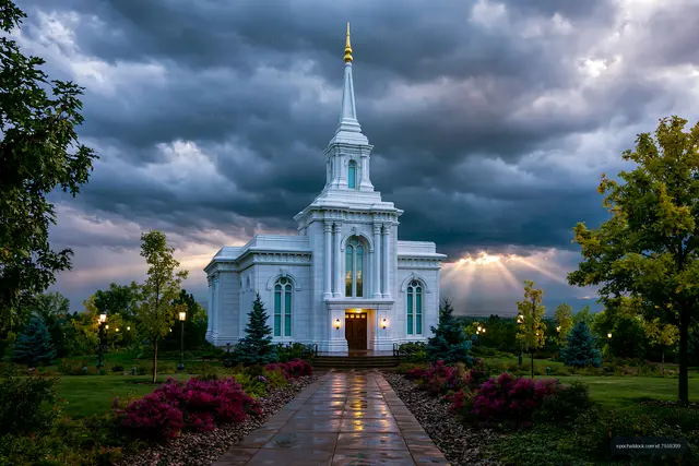 Elegant white temple after rainfall under a dramatic sky