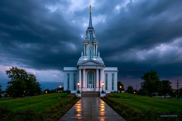 Symmetrical white temple and reflective walkway in storm light