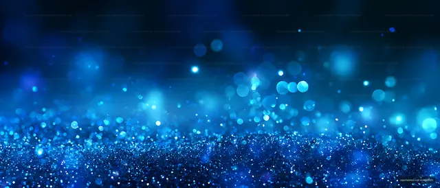 Abstract blue glitter surface with soft glowing bokeh