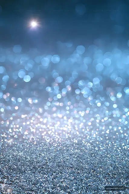 Blue glowing bokeh and glitter texture