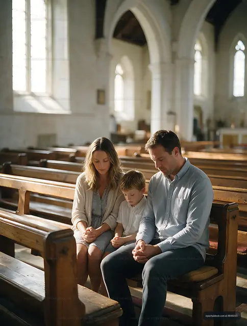Family praying together inside a church