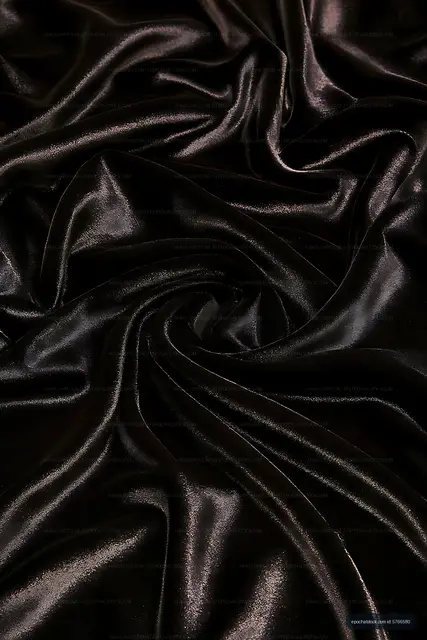 Abstract black satin folds with reflective highlights